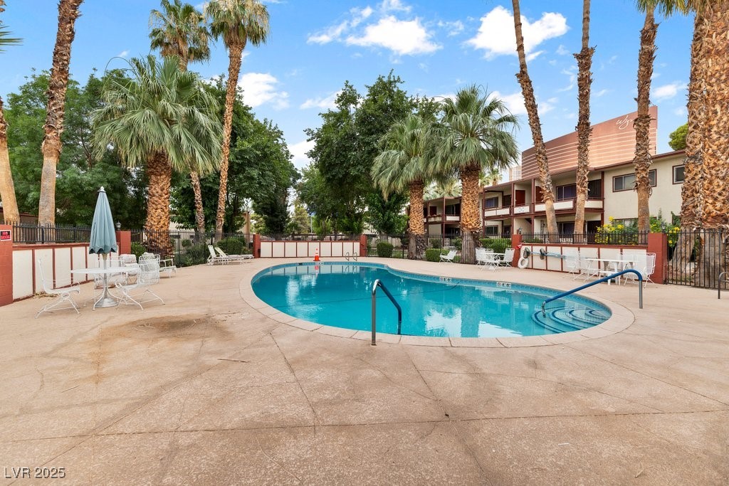 350 East Desert Inn Road, Unit H205 Las Vegas, NV 89109 - Photo 25 of 30 Community pool featuring a patio