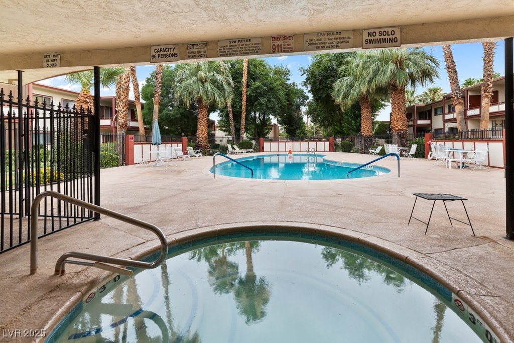 350 East Desert Inn Road, Unit H205 Las Vegas, NV 89109 - Photo 26 of 30 Community pool with a patio area