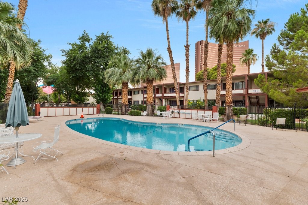 350 East Desert Inn Road, Unit H205 Las Vegas, NV 89109 - Photo 27 of 30 Community pool with a patio area