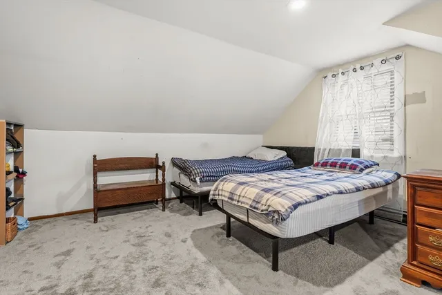 a bedroom with a bed and a table