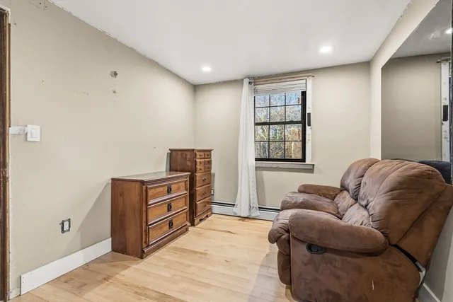 a living room with furniture and a window