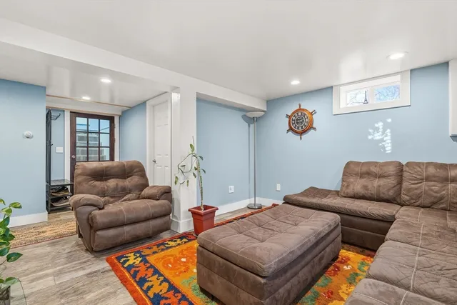 a living room with furniture and a rug