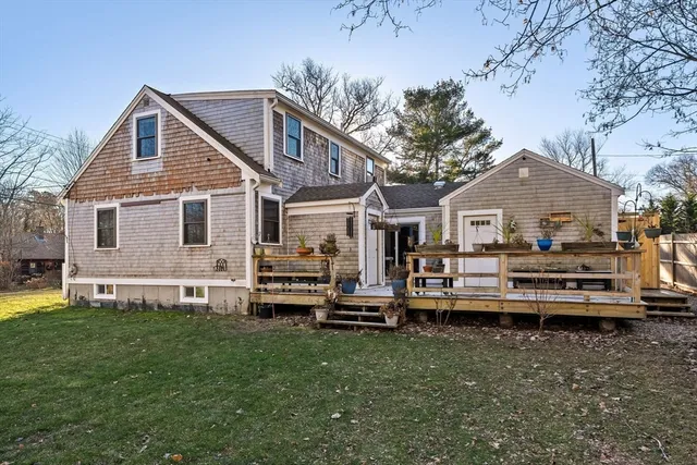 a front view of a house with a yard table and chairs