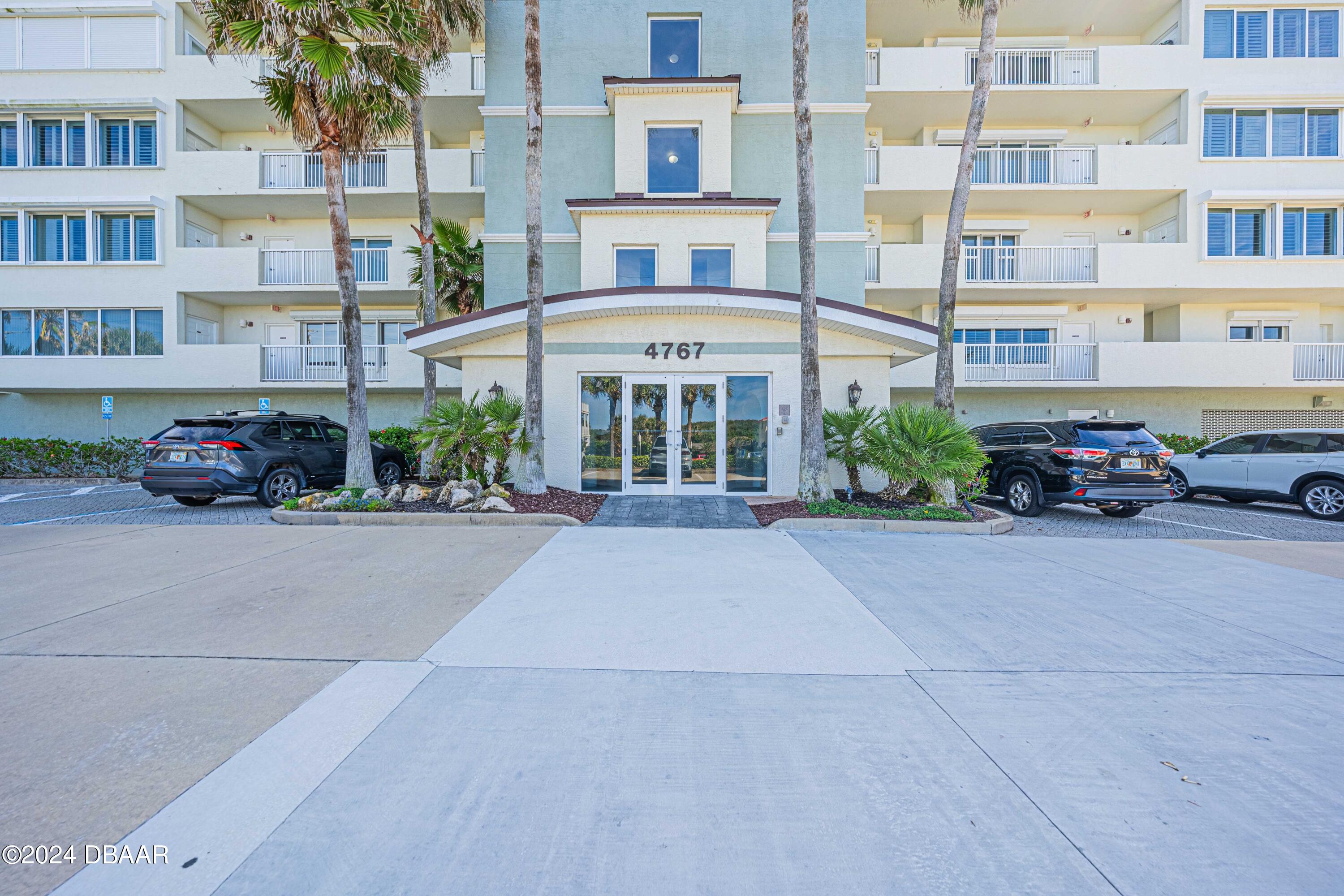 4767 South Atlantic Avenue, Unit 204 Ponce Inlet, FL 32127 - Photo 14 of 26 a car parked in front of a building