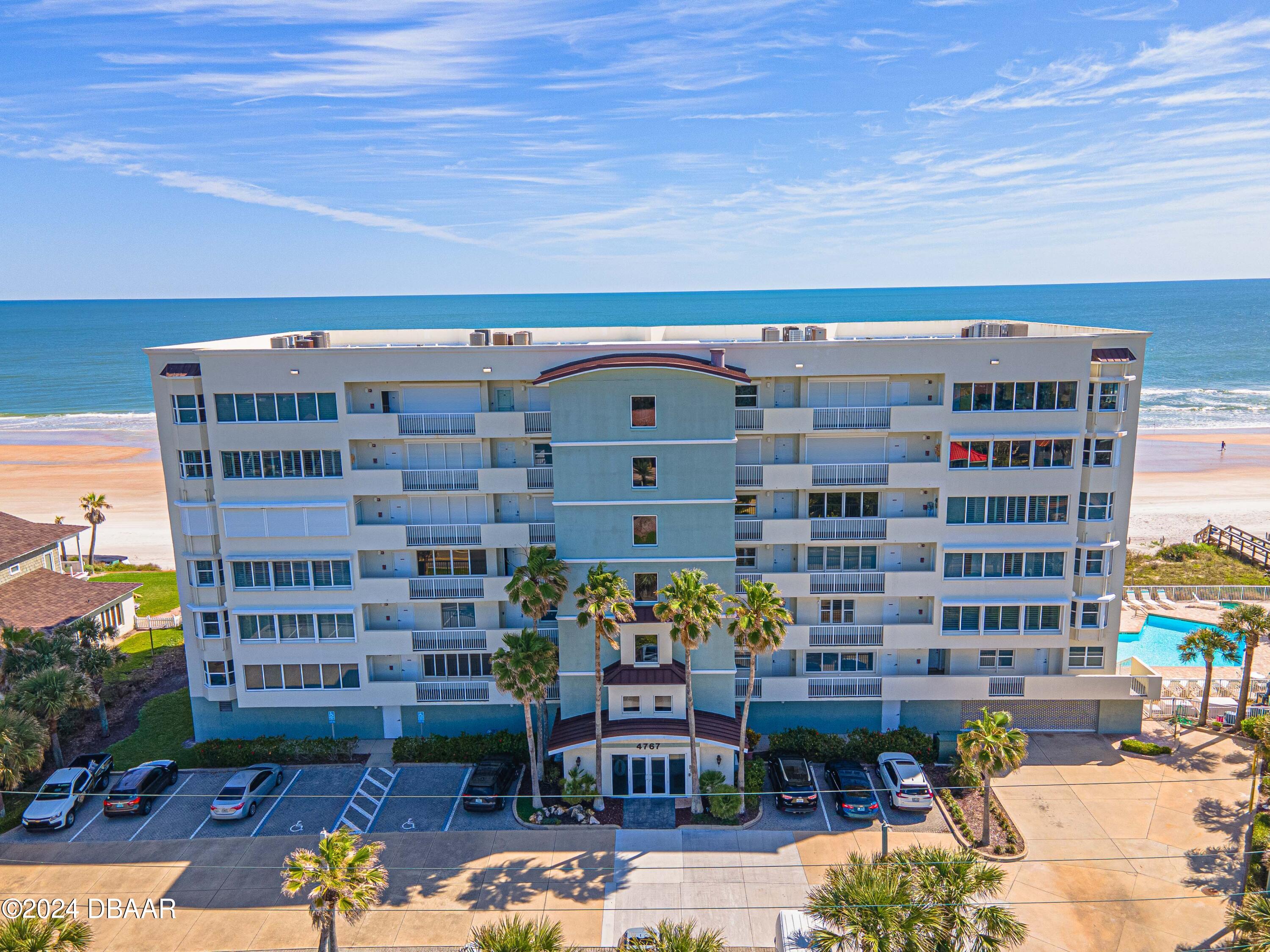 4767 South Atlantic Avenue, Unit 204 Ponce Inlet, FL 32127 - Photo 22 of 26 a front view of a building with outdoor space