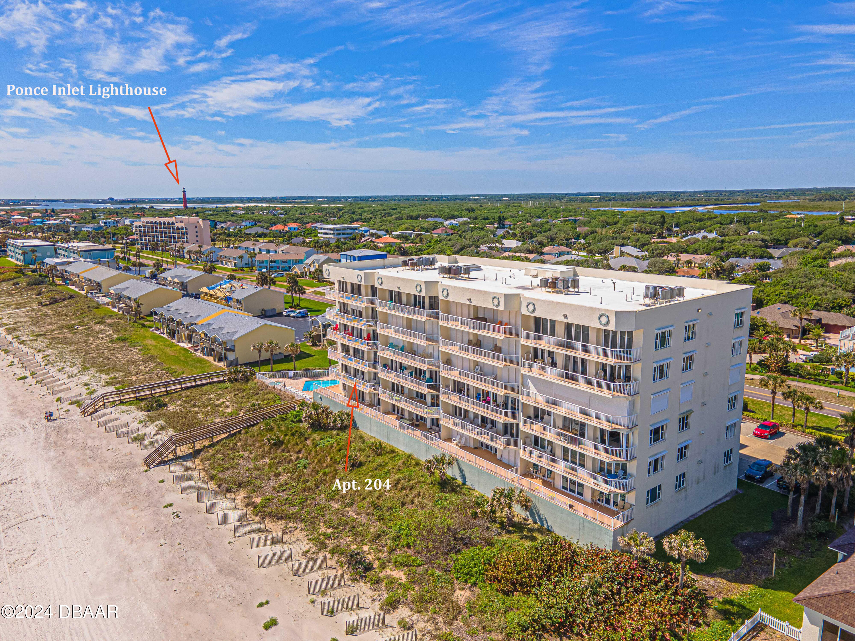 4767 South Atlantic Avenue, Unit 204 Ponce Inlet, FL 32127 - Photo 3 of 26 a view of a city with tall buildings