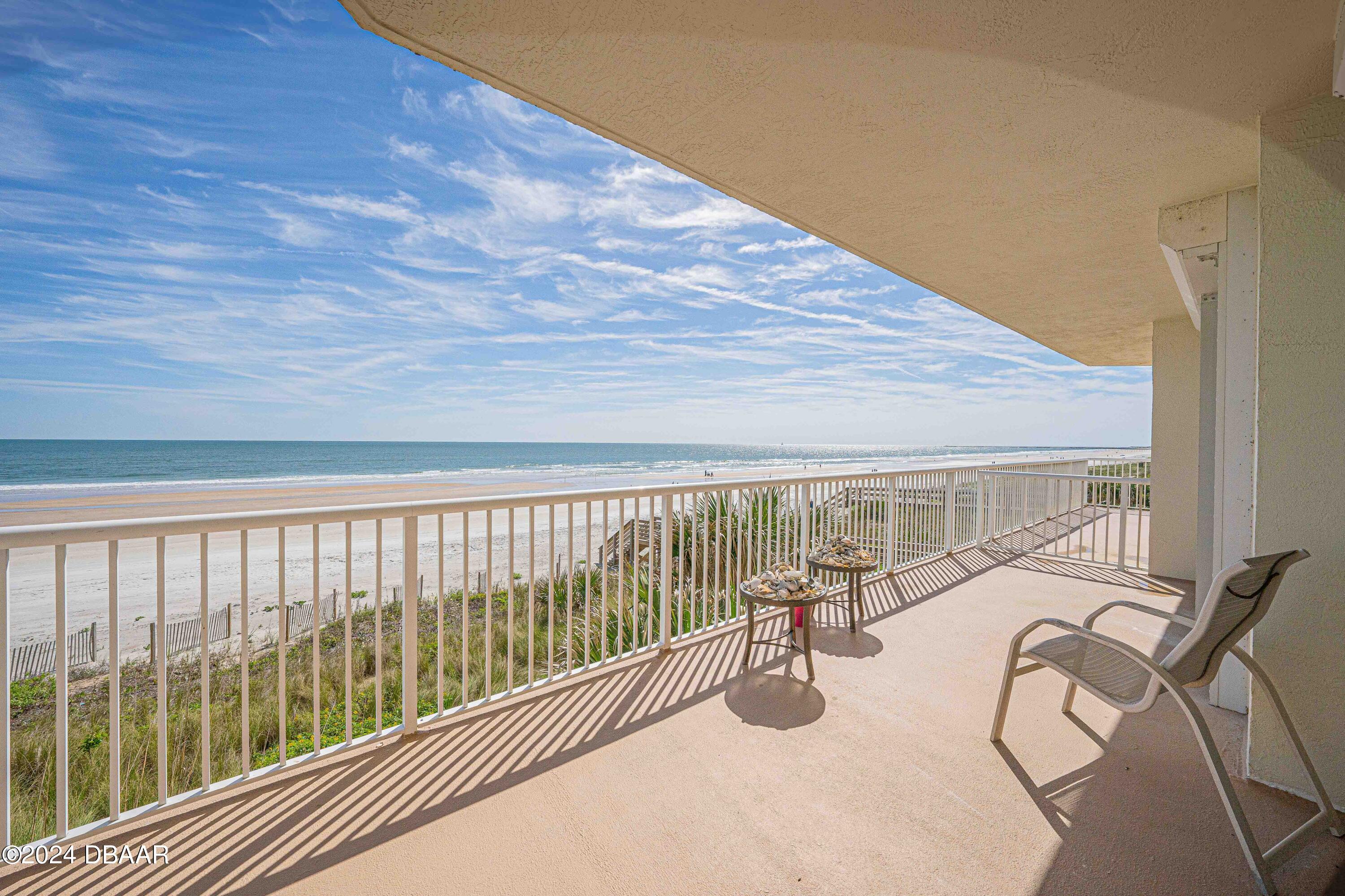 4767 South Atlantic Avenue, Unit 204 Ponce Inlet, FL 32127 - Photo 4 of 26 a view of a chairs and tables in patio