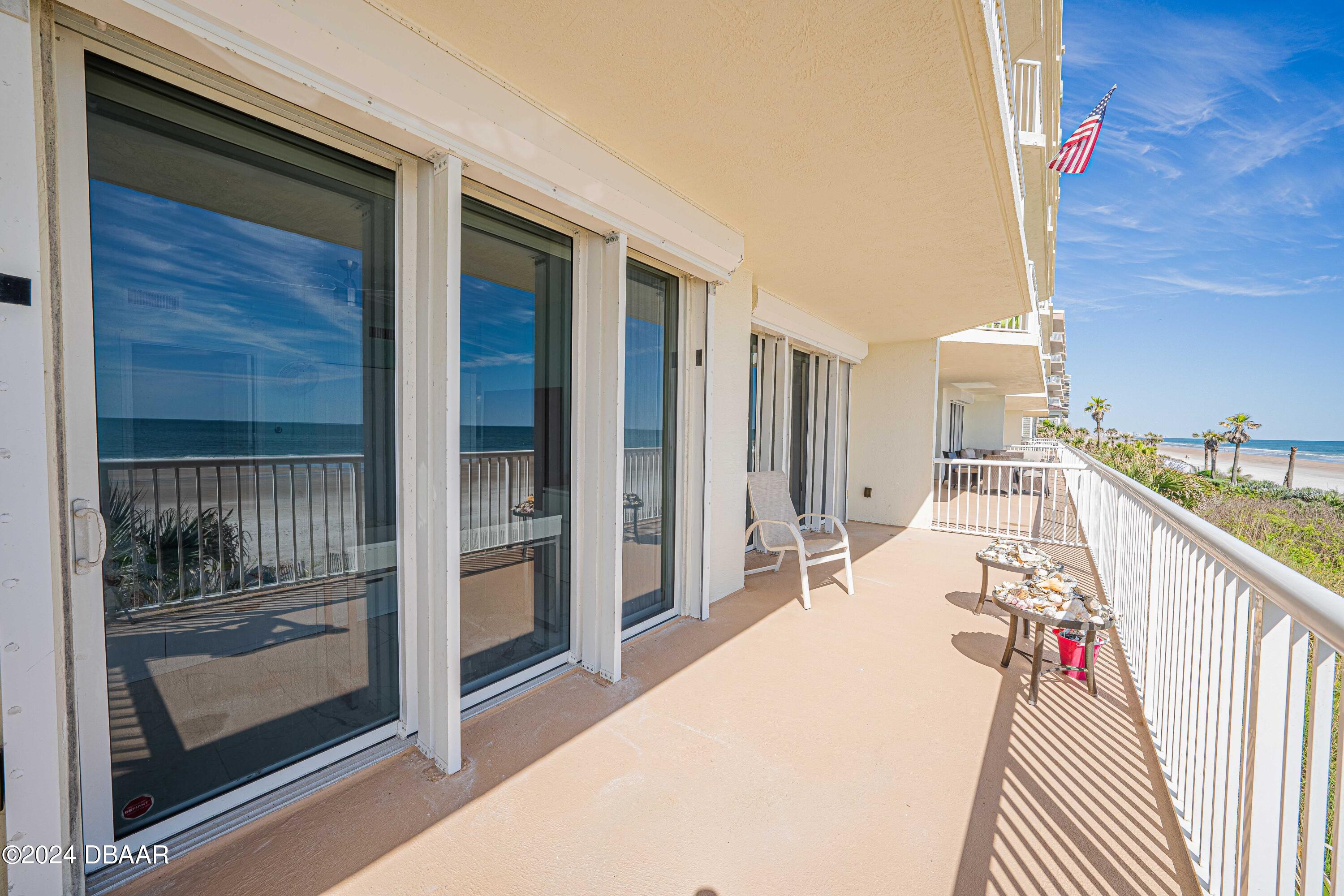 4767 South Atlantic Avenue, Unit 204 Ponce Inlet, FL 32127 - Photo 5 of 26 a balcony with view of balcony and kitchen view