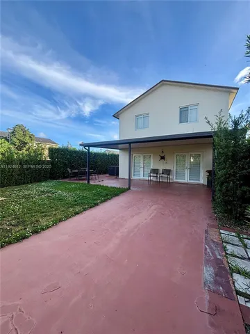 a view of house with yard and entertaining space