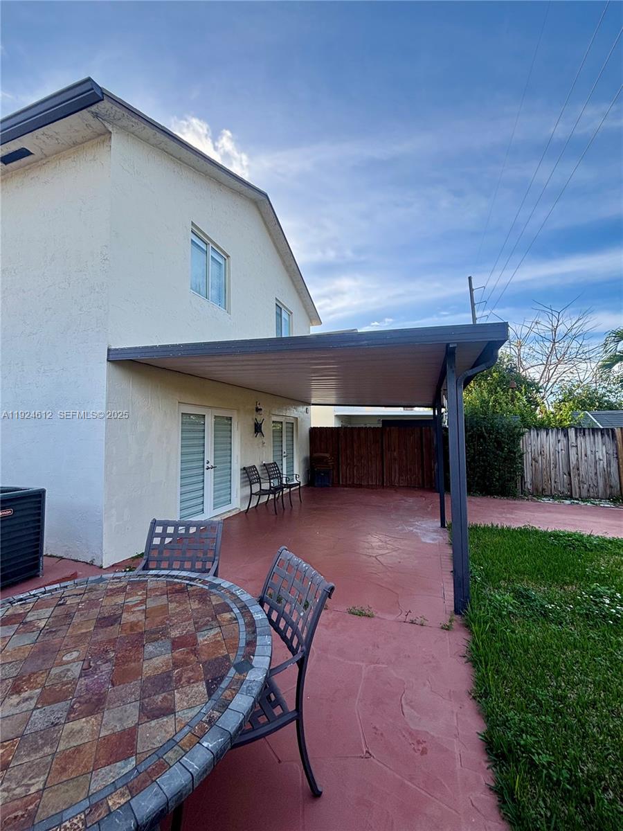 13765 Southwest 160th Terrace Miami, FL 33177 - Photo 19 of 47 a view of a house with backyard and porch