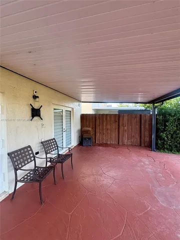 a view of an empty room with a lounge chair