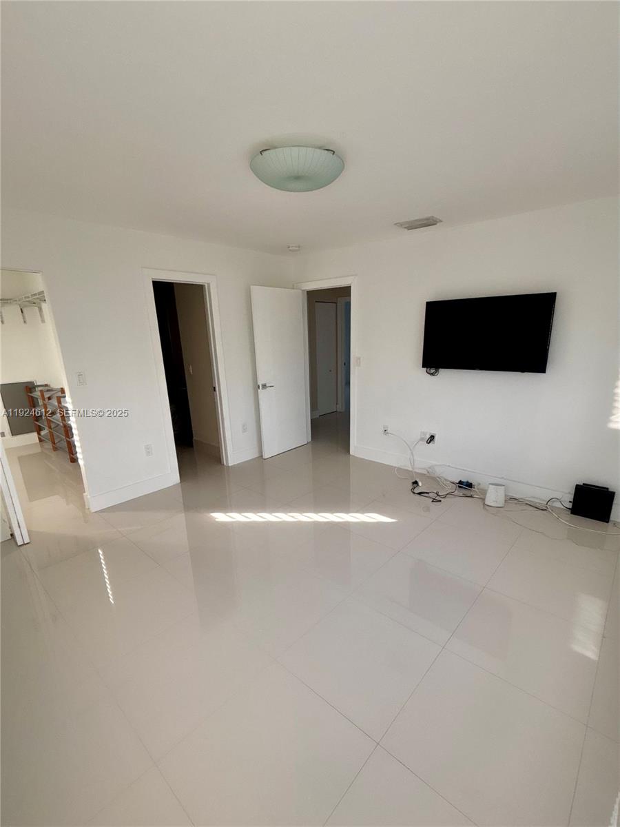 13765 Southwest 160th Terrace Miami, FL 33177 - Photo 25 of 47 a view of a livingroom with a flat screen tv