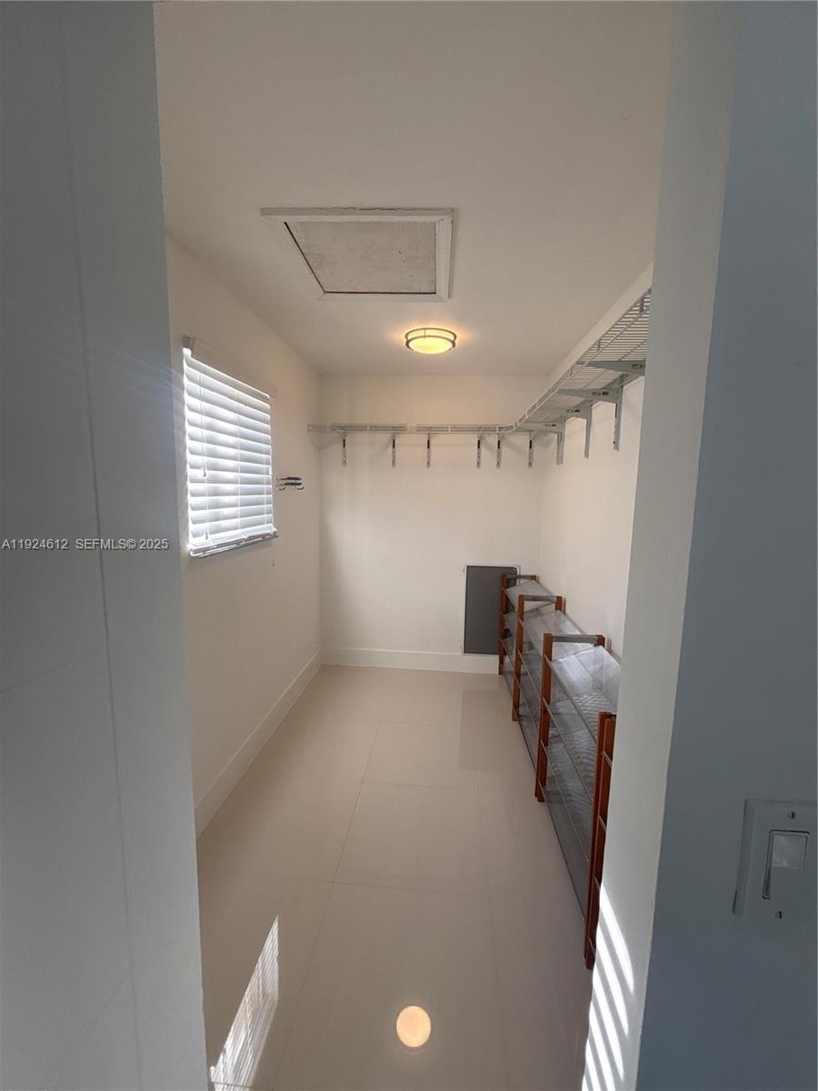 13765 Southwest 160th Terrace Miami, FL 33177 - Photo 27 of 47 a view of empty room with wooden floor and fan