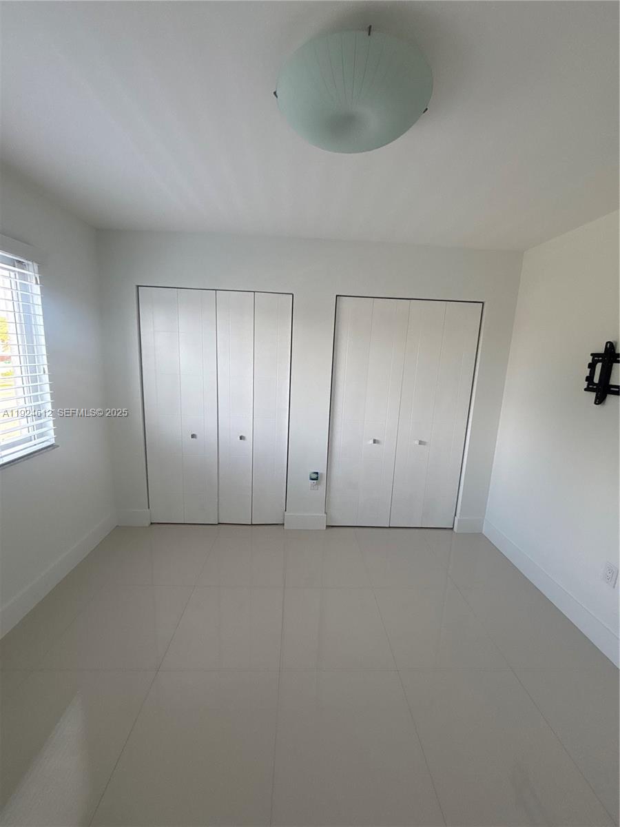 13765 Southwest 160th Terrace Miami, FL 33177 - Photo 34 of 47 an empty room with windows