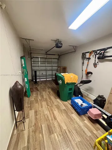a room with gym equipment and a mirror