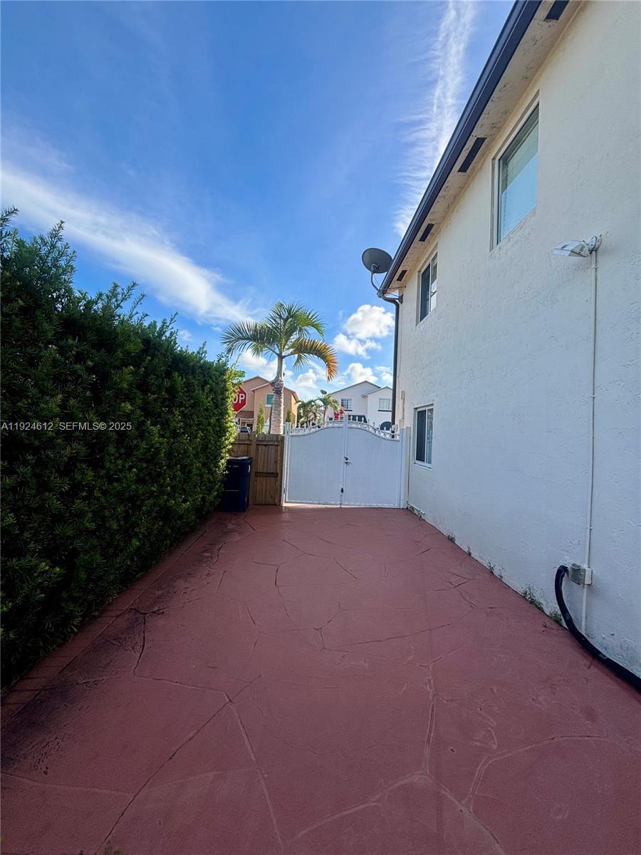 13765 Southwest 160th Terrace Miami, FL 33177 - Photo 46 of 47 a view of a house with a yard