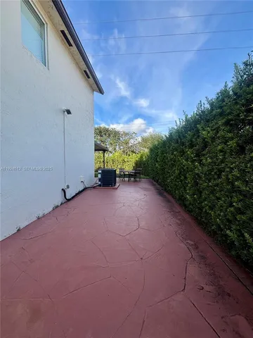 a view of a backyard of the house