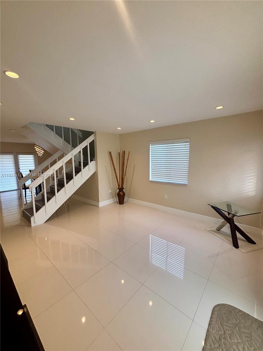 13765 Southwest 160th Terrace Miami, FL 33177 - Photo 6 of 47 a view of an empty room with windows