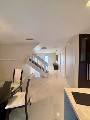 a view of a living room and dining room