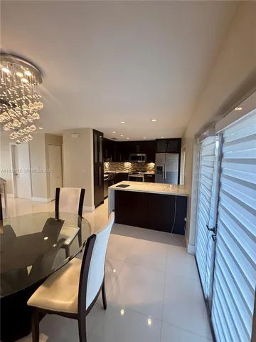 a living room with furniture a fireplace and a table