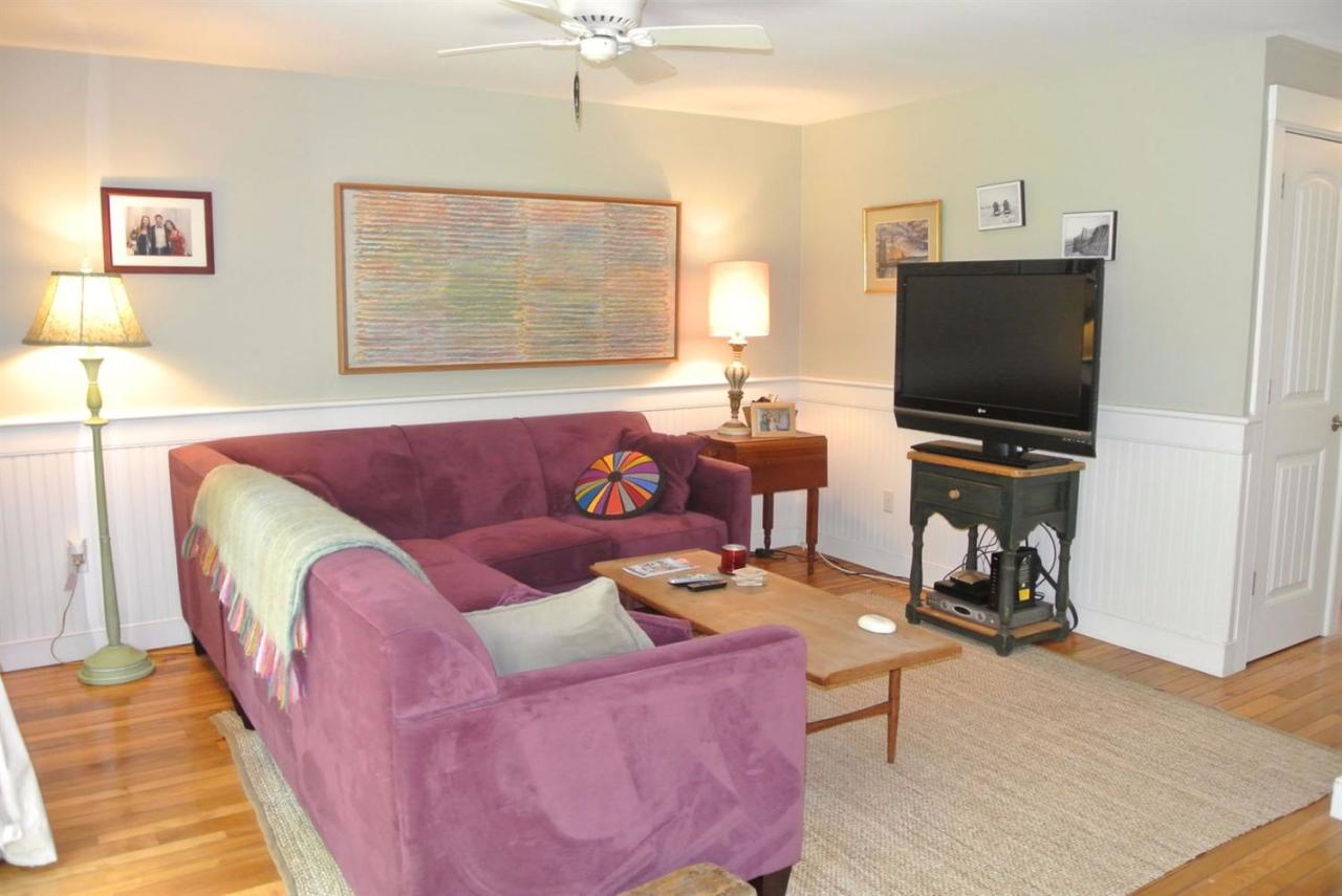 83 Summersea Road Mashpee, MA 02649 - Photo 11 of 25 a living room with furniture and a flat screen tv