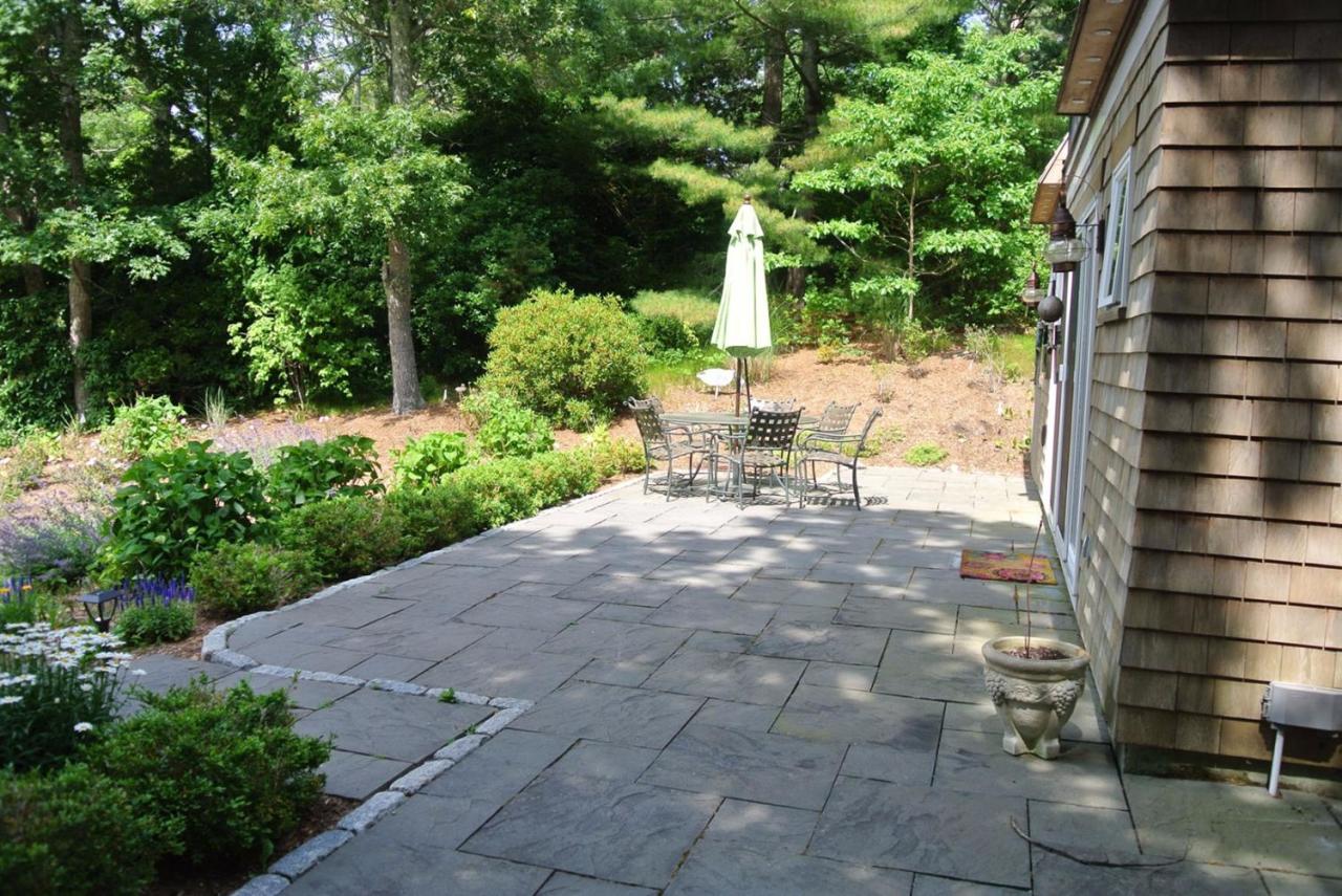 83 Summersea Road Mashpee, MA 02649 - Photo 2 of 25 a view of backyard with outdoor seating and plants