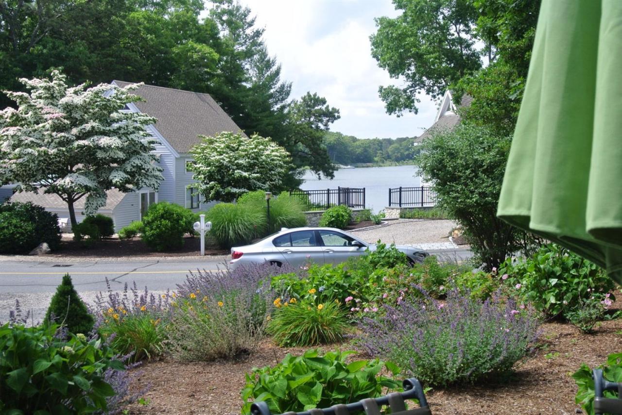 83 Summersea Road Mashpee, MA 02649 - Photo 21 of 25 a view of a house with a yard and tree s