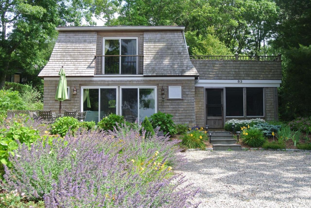 83 Summersea Road Mashpee, MA 02649 - Photo 25 of 25 a front view of a house with garden and porch
