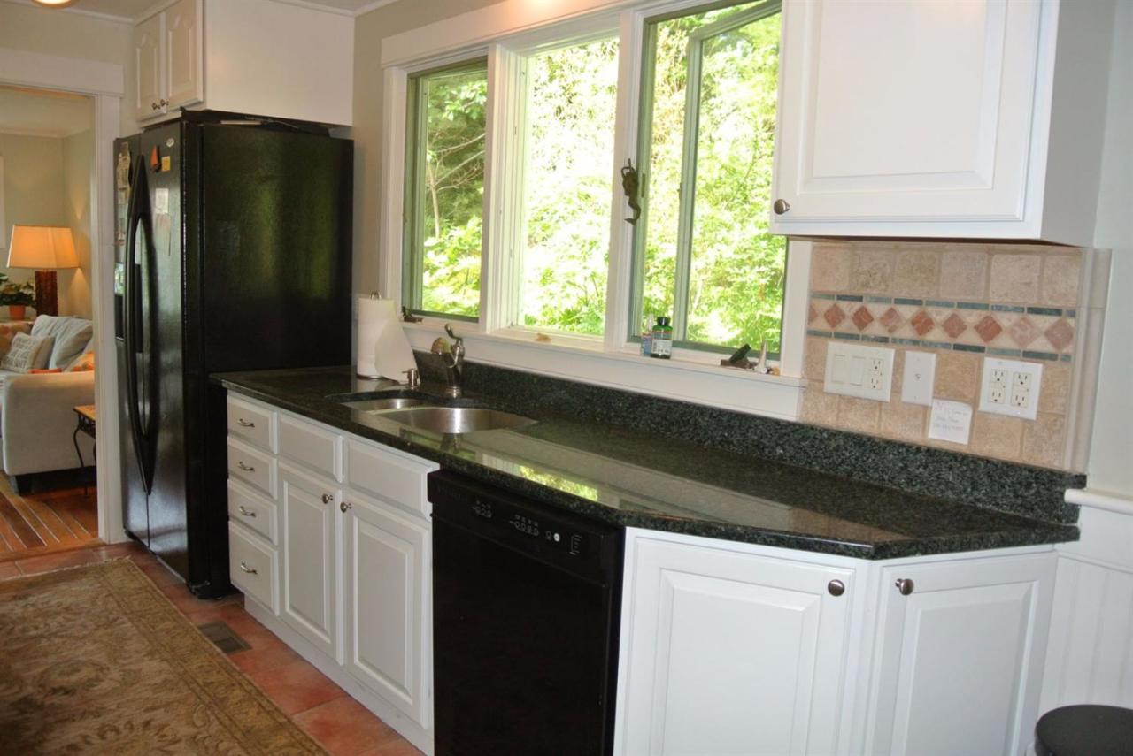83 Summersea Road Mashpee, MA 02649 - Photo 6 of 25 a kitchen with granite countertop a refrigerator and a sink