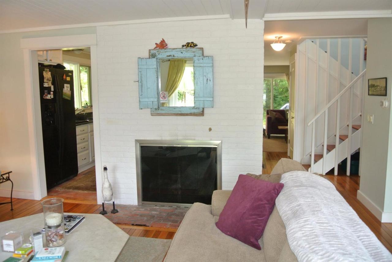 83 Summersea Road Mashpee, MA 02649 - Photo 10 of 25 a living room with furniture and a fireplace