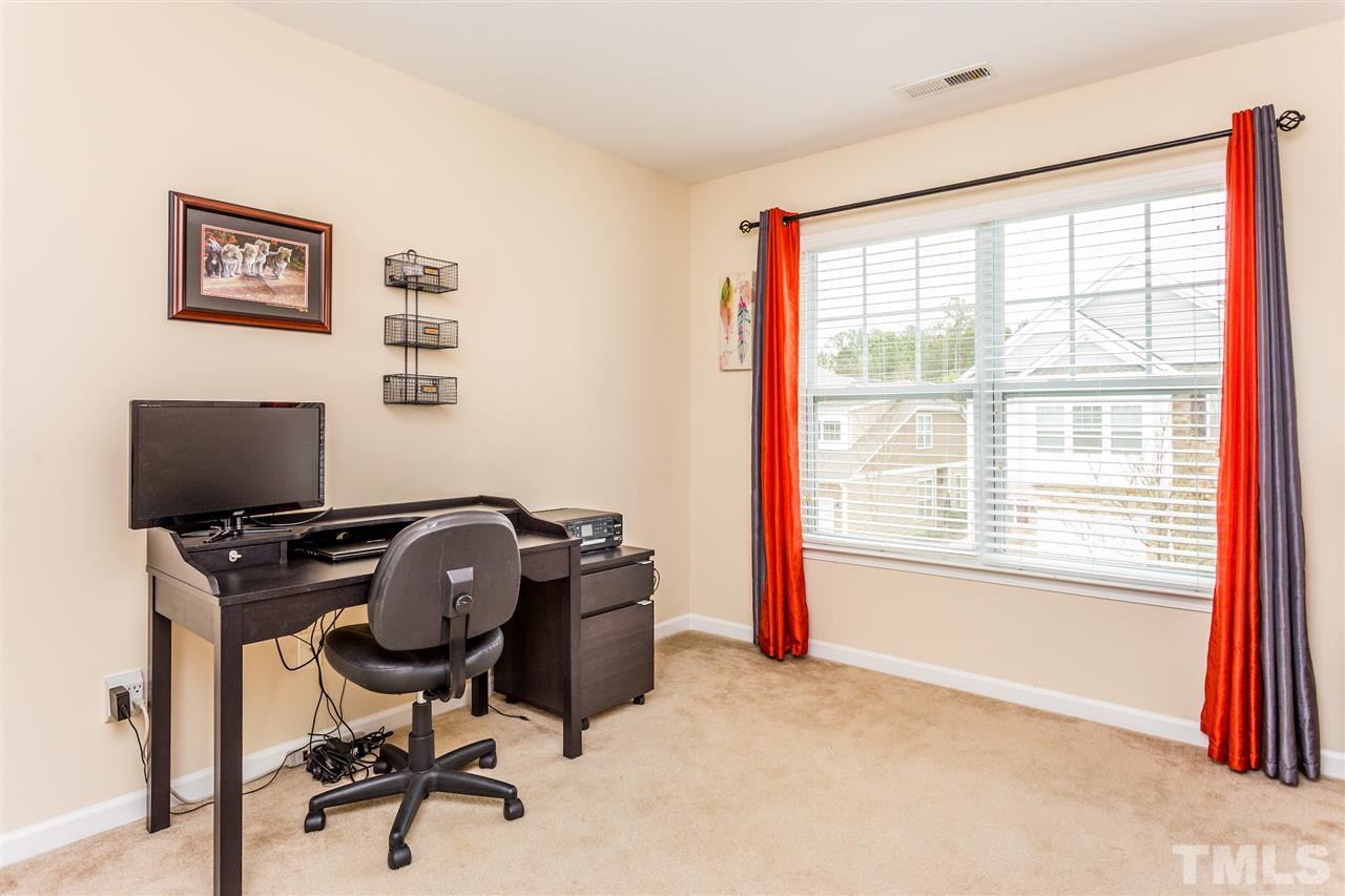 2410 Memory Ridge Drive Raleigh, NC 27606 - Photo 15 of 20 a view of a workspace with furniture and a window