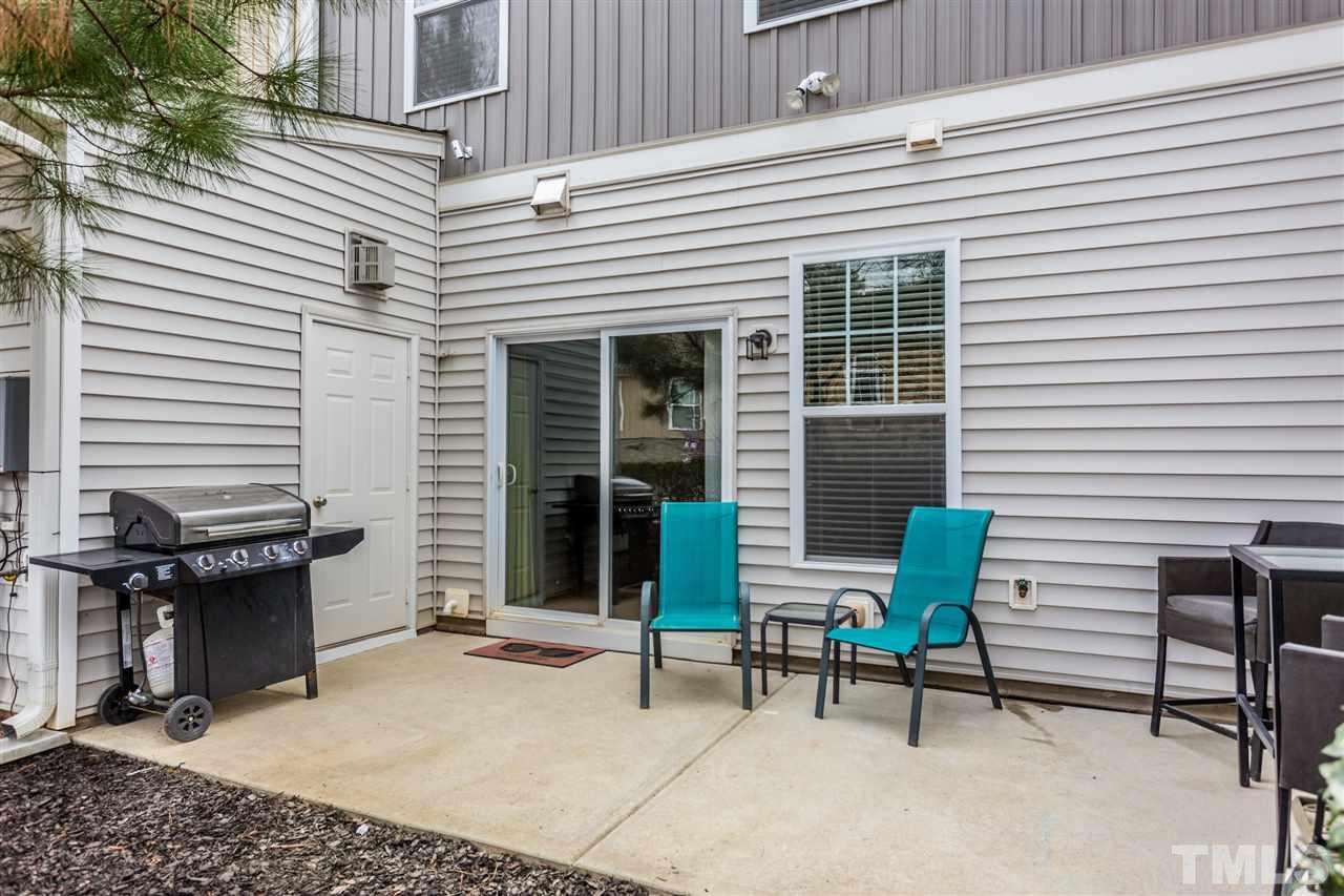 2410 Memory Ridge Drive Raleigh, NC 27606 - Photo 17 of 20 a view of a house with chairs and a table in a patio