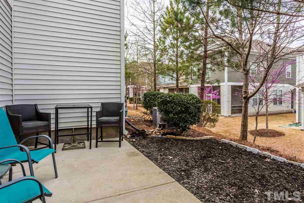 2410 Memory Ridge Drive Raleigh, NC 27606 - Photo 18 of 20 a view of a chairs and table in the backyard