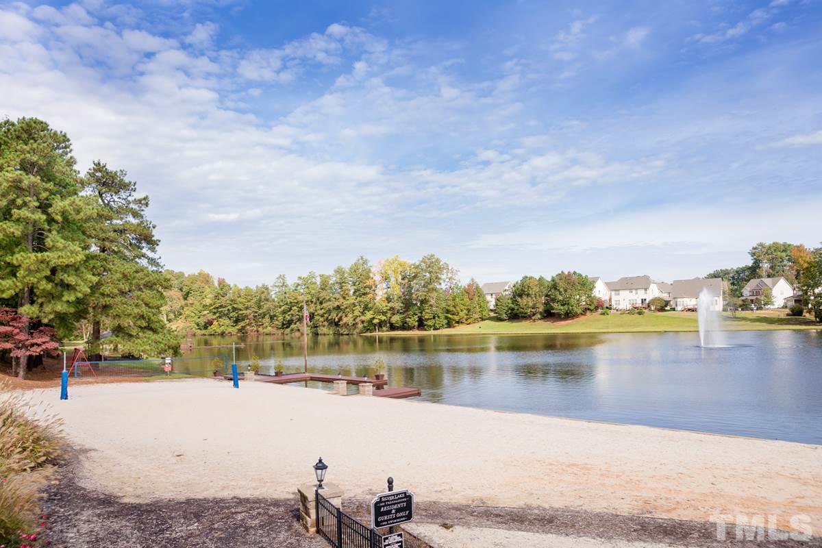 2410 Memory Ridge Drive Raleigh, NC 27606 - Photo 19 of 20 a view of a lake with houses in the back