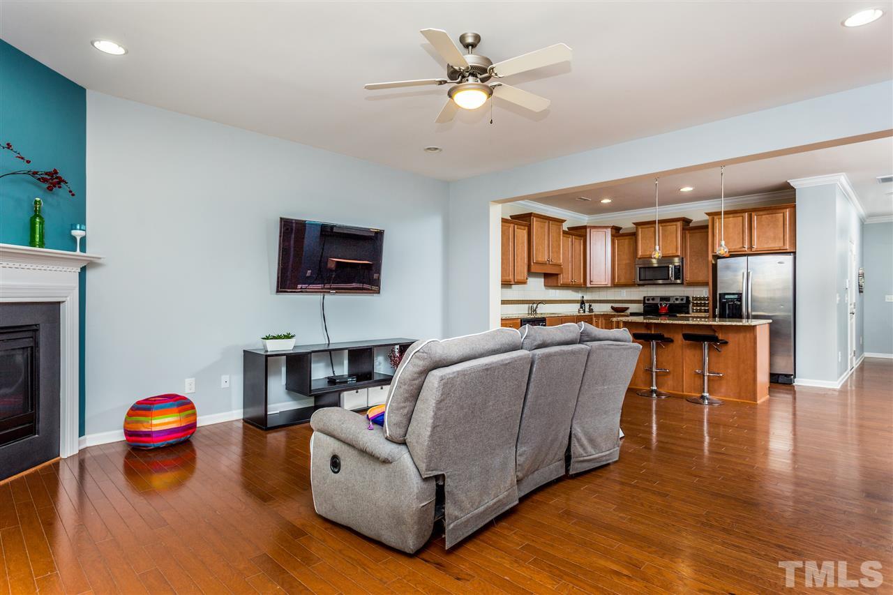 2410 Memory Ridge Drive Raleigh, NC 27606 - Photo 7 of 20 a living room with furniture and kitchen view