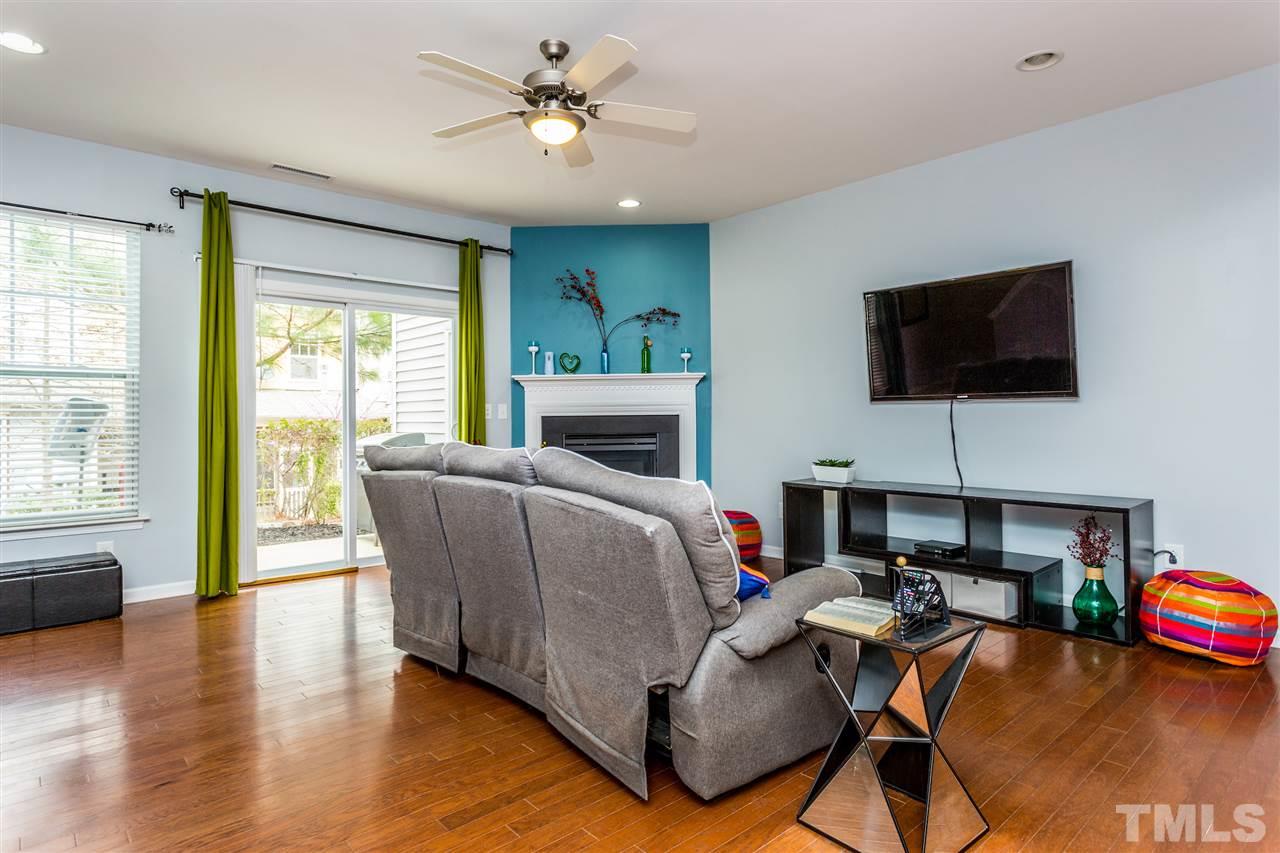 2410 Memory Ridge Drive Raleigh, NC 27606 - Photo 9 of 20 a living room with furniture and a flat screen tv