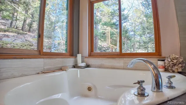 a bathroom with a tub and sink