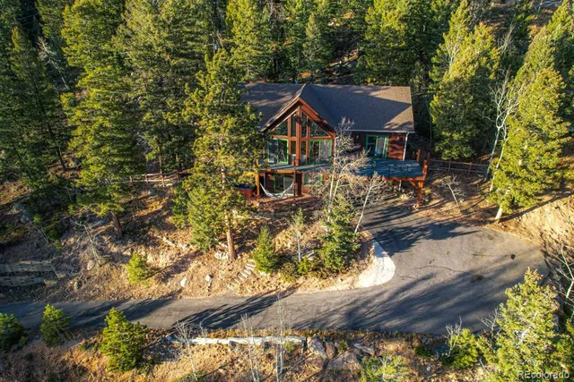 a view of house with yard