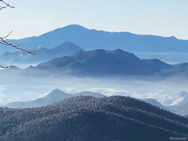 a view of a town with mountains in the background