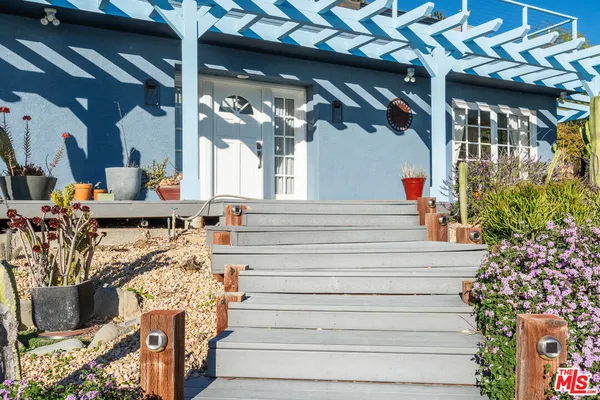 a patio with table and chairs