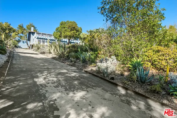 a view of a backyard of the house