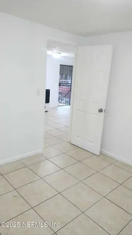 a bathroom with a toilet and a bathtub