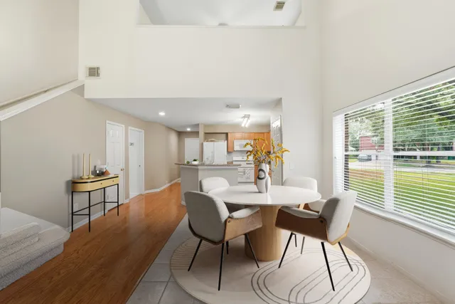 a view of a dining room with furniture window and wooden floor