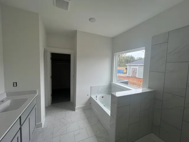 a kitchen with a sink and a refrigerator