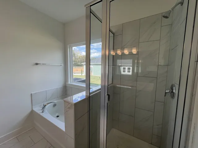 a bathroom with a shower and a sink