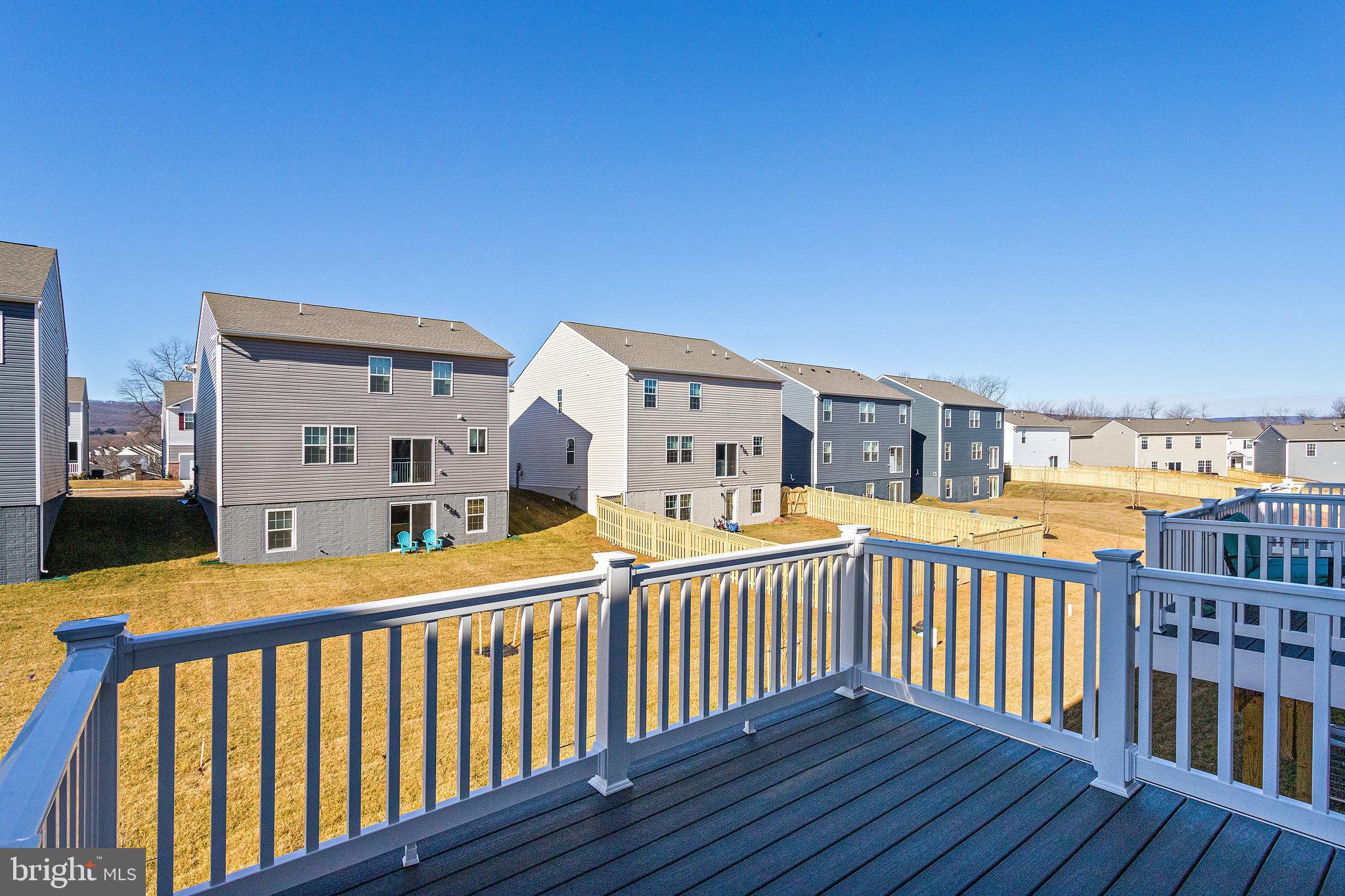 1271 Apollo Drive Frederick, MD 21702 - Photo 19 of 42 a view of a balcony with wooden floor and fence