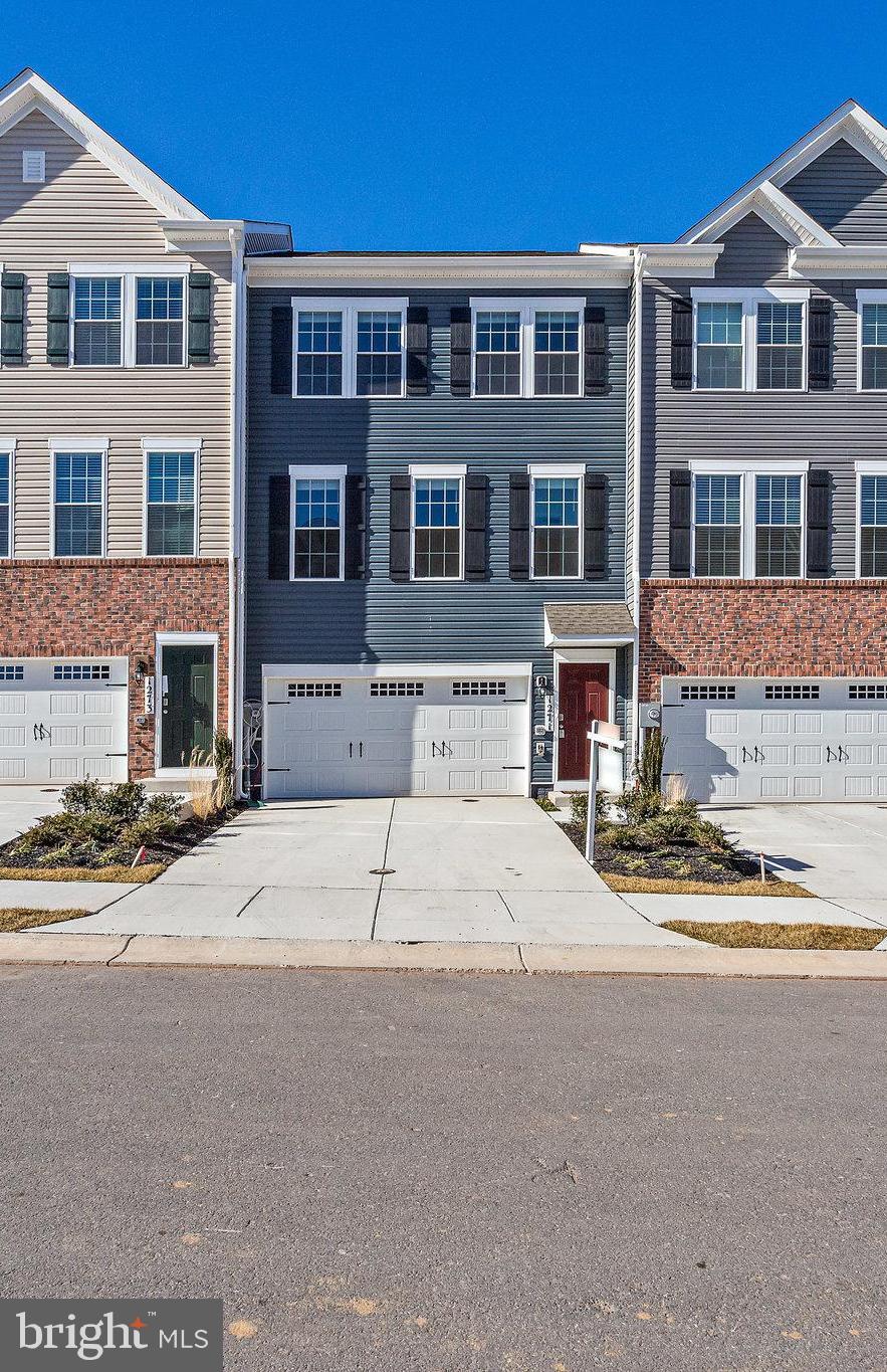 1271 Apollo Drive Frederick, MD 21702 - Photo 2 of 42 a front view of a building with street