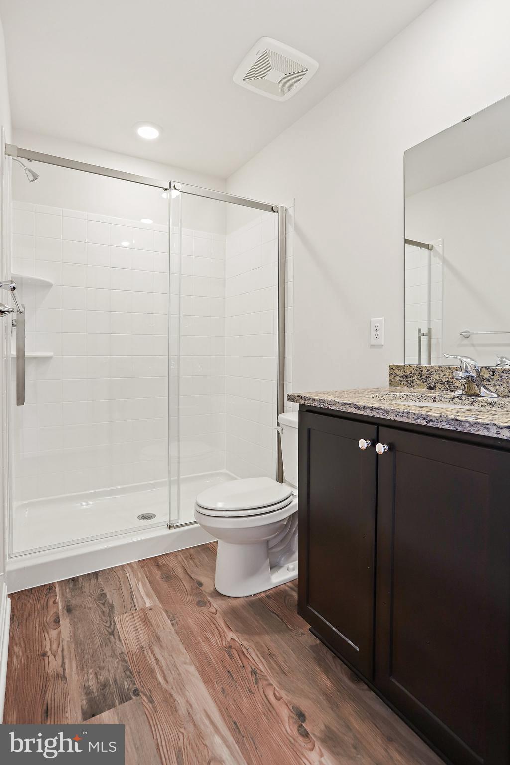 1271 Apollo Drive Frederick, MD 21702 - Photo 27 of 42 a bathroom with a toilet a sink and shower