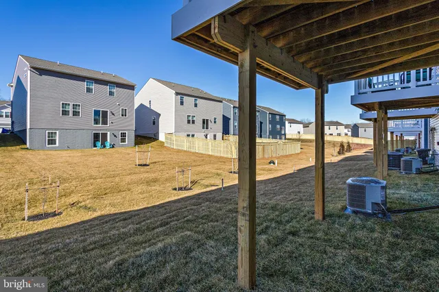 a front view of a building with a yard