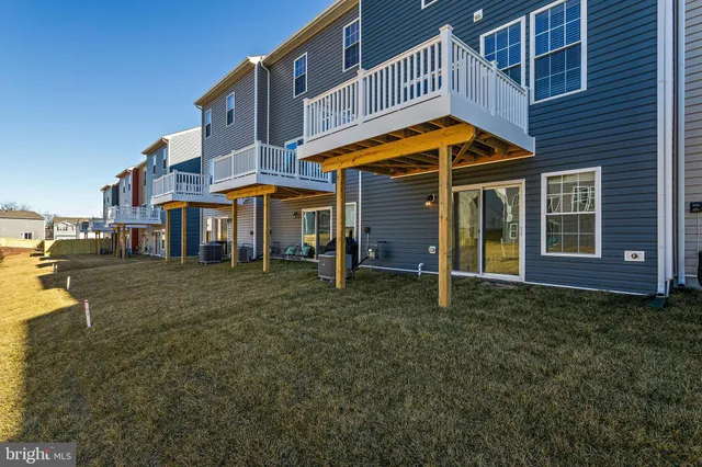 a view of street with houses on both side of it
